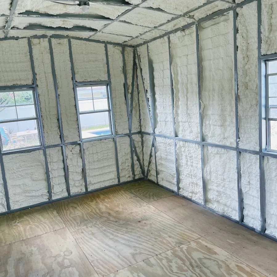 Closed-cell spray foam insulation applied to wall cavities in a residential project in Friendswood